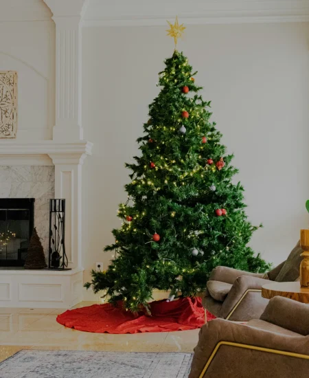 Basement Christmas tree decoration with cozy lights and ornaments.