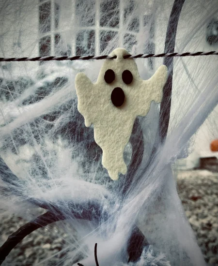 Soft felt ghost decorations handmade for spooky Halloween home decor.