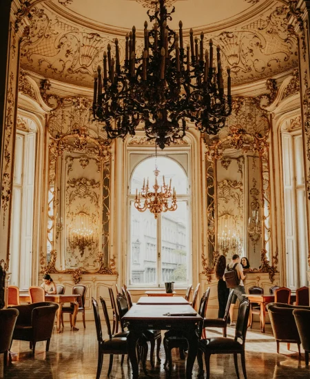 Gothic dining table with dark florals, candles, and ornate chairs