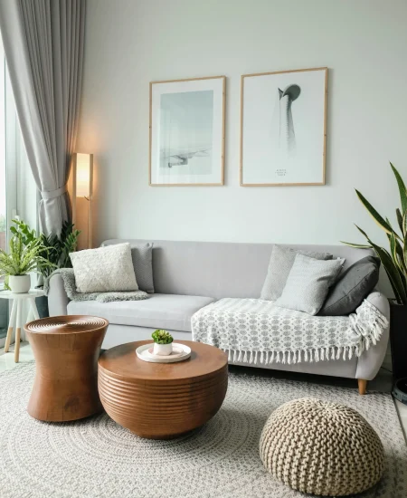 Minimalist living room with beige sofa, open space, and cozy lighting