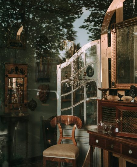 Close-up of vintage living room details—antique decor, warm textures, soft lighting